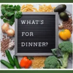 What's for Dinner letter board with fresh vegetables and pasta
